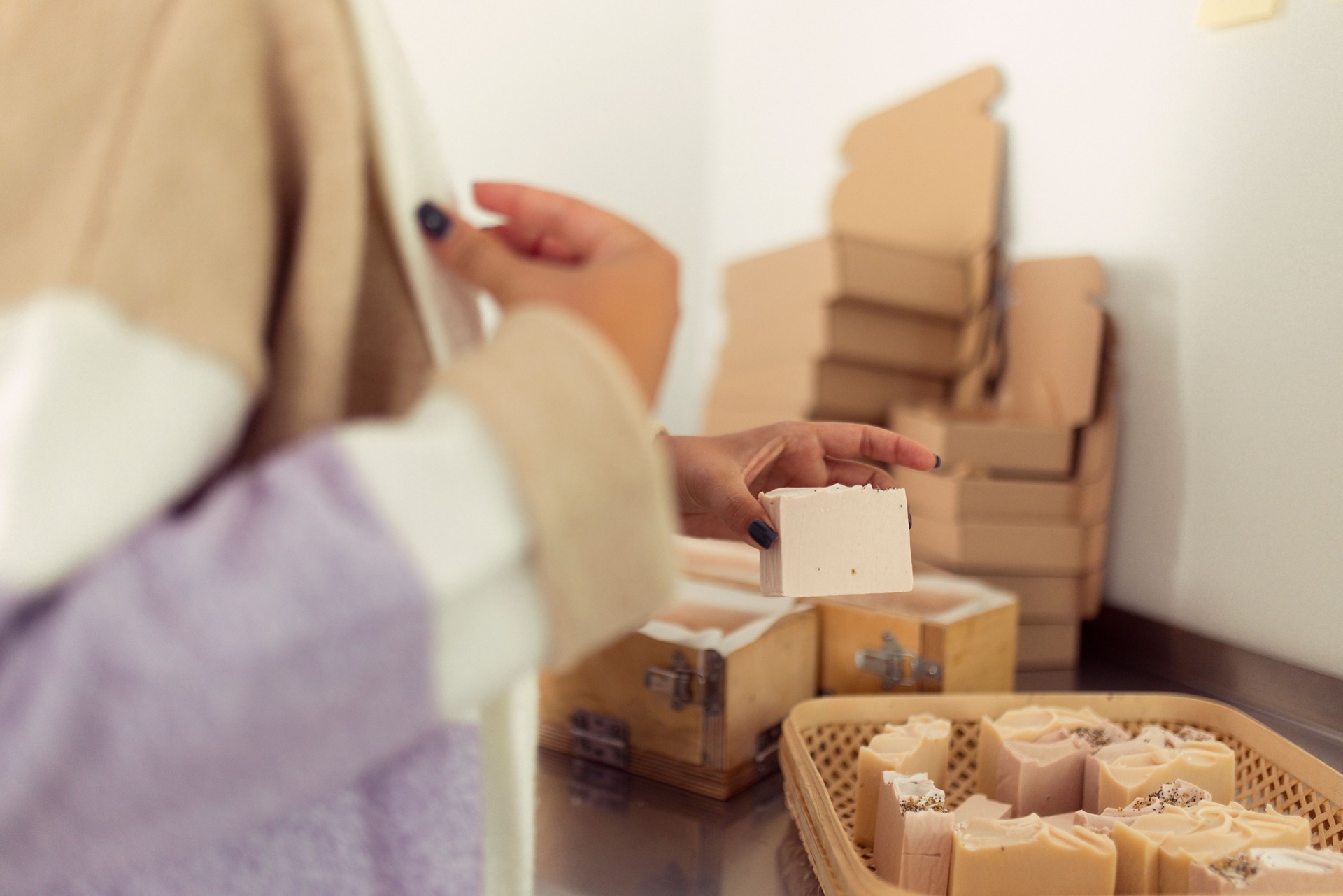 The owner of a small business prepares the orders of her customers. She prepares the products for packing in cardboard boxes and sending them to customers