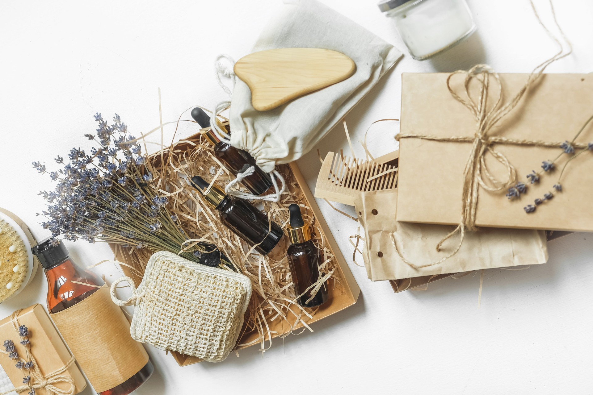 Flat lay composition with natural cosmetics, lavender flowers and natural oils.Eco friendly self care box gift handmade wellness box organic.